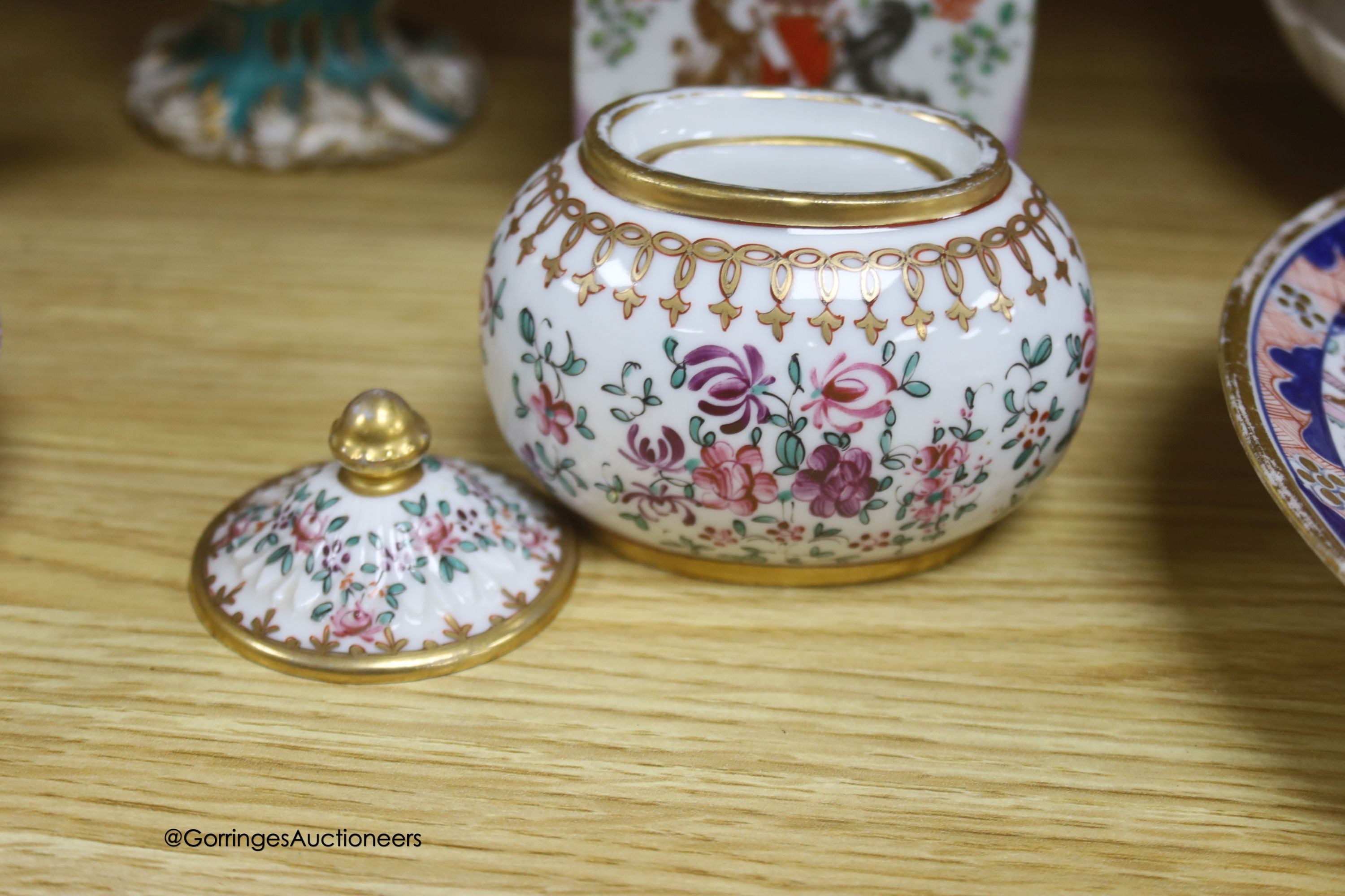 A pair of Rockingham style floral encrusted lidded vases, an armorial jar, two 19th-century English porcelain dishes etc